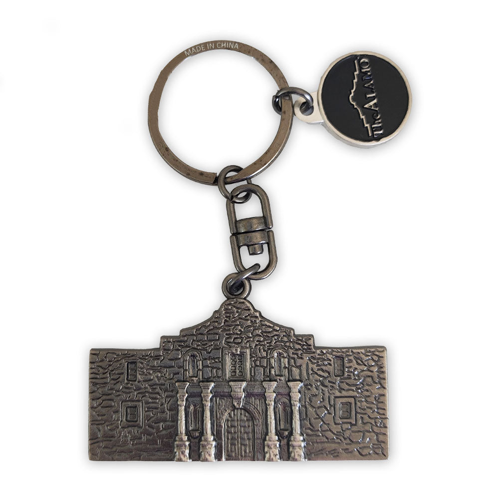 The Alamo Metal Molded Keychain features a detailed, raised design of the Alamo mission and a round charm above with “Alamo” and its outline, making it a perfect souvenir from the historic site.
