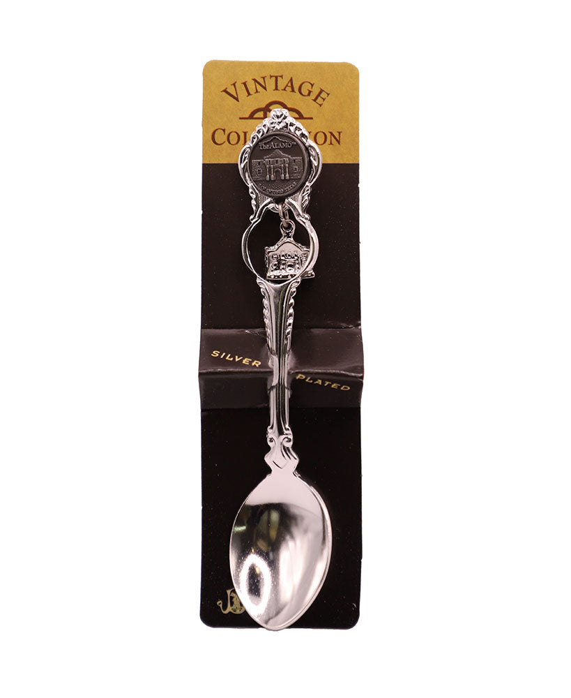 The Alamo Charm Spoon features ornate silver plating and an Alamo charm on the handle, displayed on a black and gold “Vintage Collection” card—perfect as a Texas independence gift.
