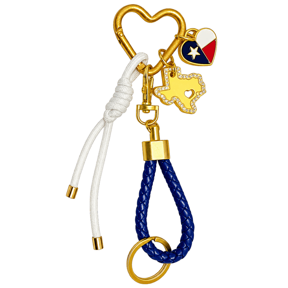 Texas Carabiner Bag Clip featuring a heart-shaped gold clip, a blue braided loop, a white knotted cord, a Texas-shaped charm, and a heart-shaped charm with a Texas flag design.