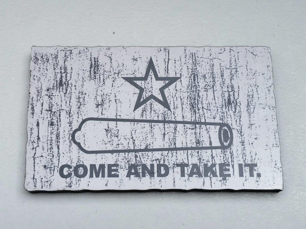 The 'Come and Take It' Distressed-Look Magnet features a black cannon outline, a star above, and "COME AND TAKE IT" below, echoing the historic Texas Revolution flag.