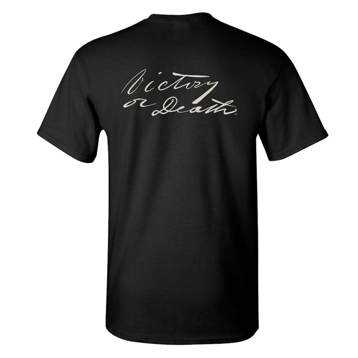 The Victory or Death T-Shirt features "Victory or Death." in white script across the upper back, echoing the bold spirit of the Travis Letter. Shown in black from the back.