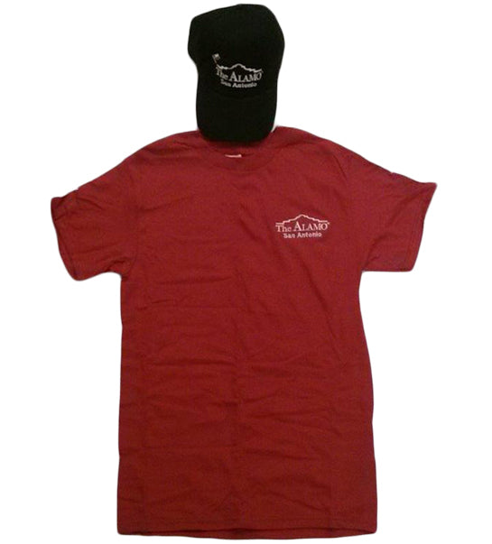 The Adult Alamo Cap and Tee Combo includes a cardinal tee and black cap, both with The Alamo San Antonio logo in white text. The red shirt is laid flat with the black cap above its neckline.